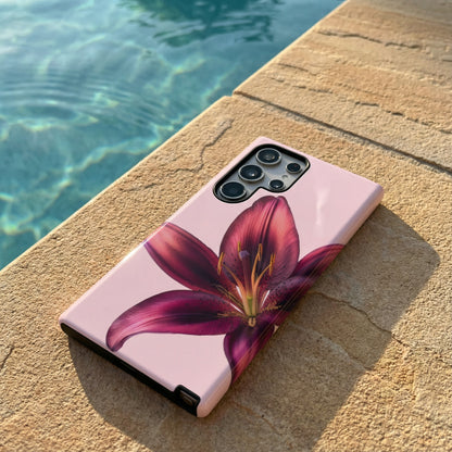 samsung galaxy S24 ultra case with purple flower design sitting on a stone surface poolside