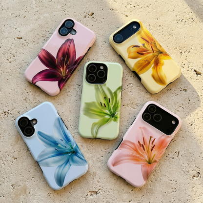 Five floral iphone cases sitting on a limestone textured surface