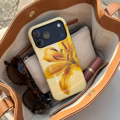 iPhone 17 pro max case with a yellow floral design sitting inside a handbag