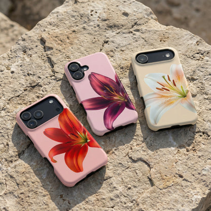 Three floral iphone 17 cases sitting on a stone surface