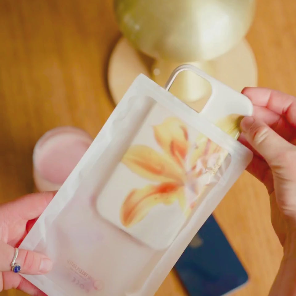unboxing video of a yellow floral iphone case